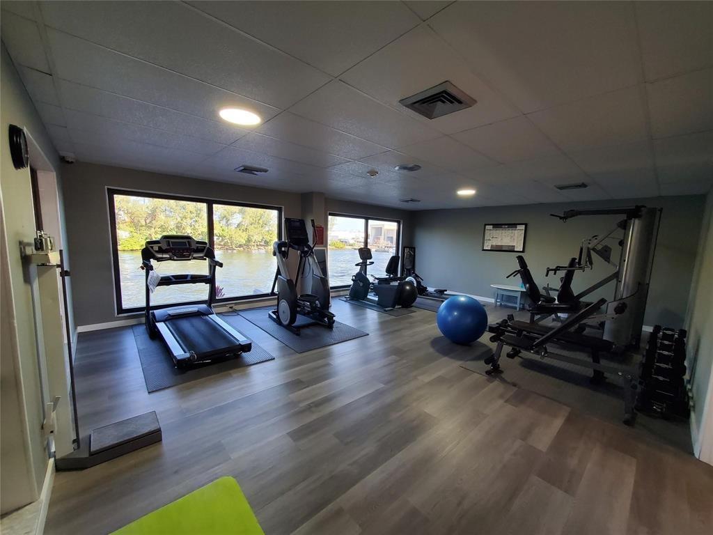 1401 North Riverside Drive, Unit 705 Pompano Beach, FL 33062 - Photo 25 of 30 a view of a room with gym equipment