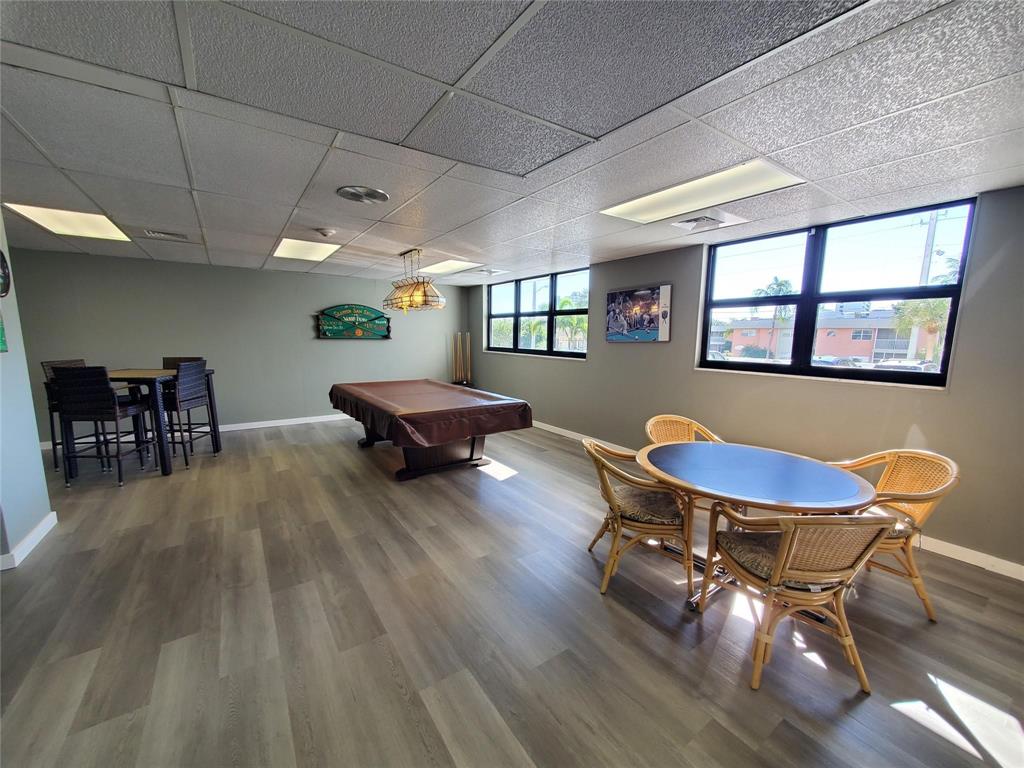 1401 North Riverside Drive, Unit 705 Pompano Beach, FL 33062 - Photo 26 of 30 a living room with furniture and a wooden floor