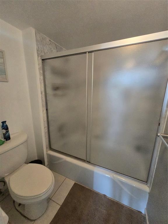 1401 North Riverside Drive, Unit 705 Pompano Beach, FL 33062 - Photo 10 of 30 a bathroom with a toilet and a shower