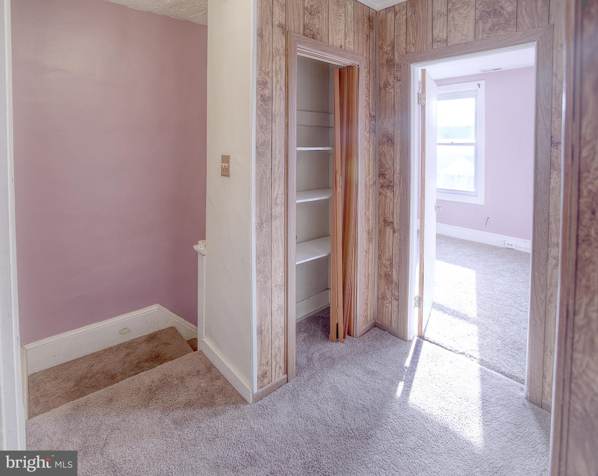 1332 Cambria Street Baltimore, MD 21225 - Photo 17 of 31 a view of an empty room and window