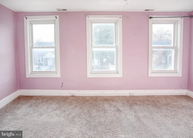 an empty room with windows