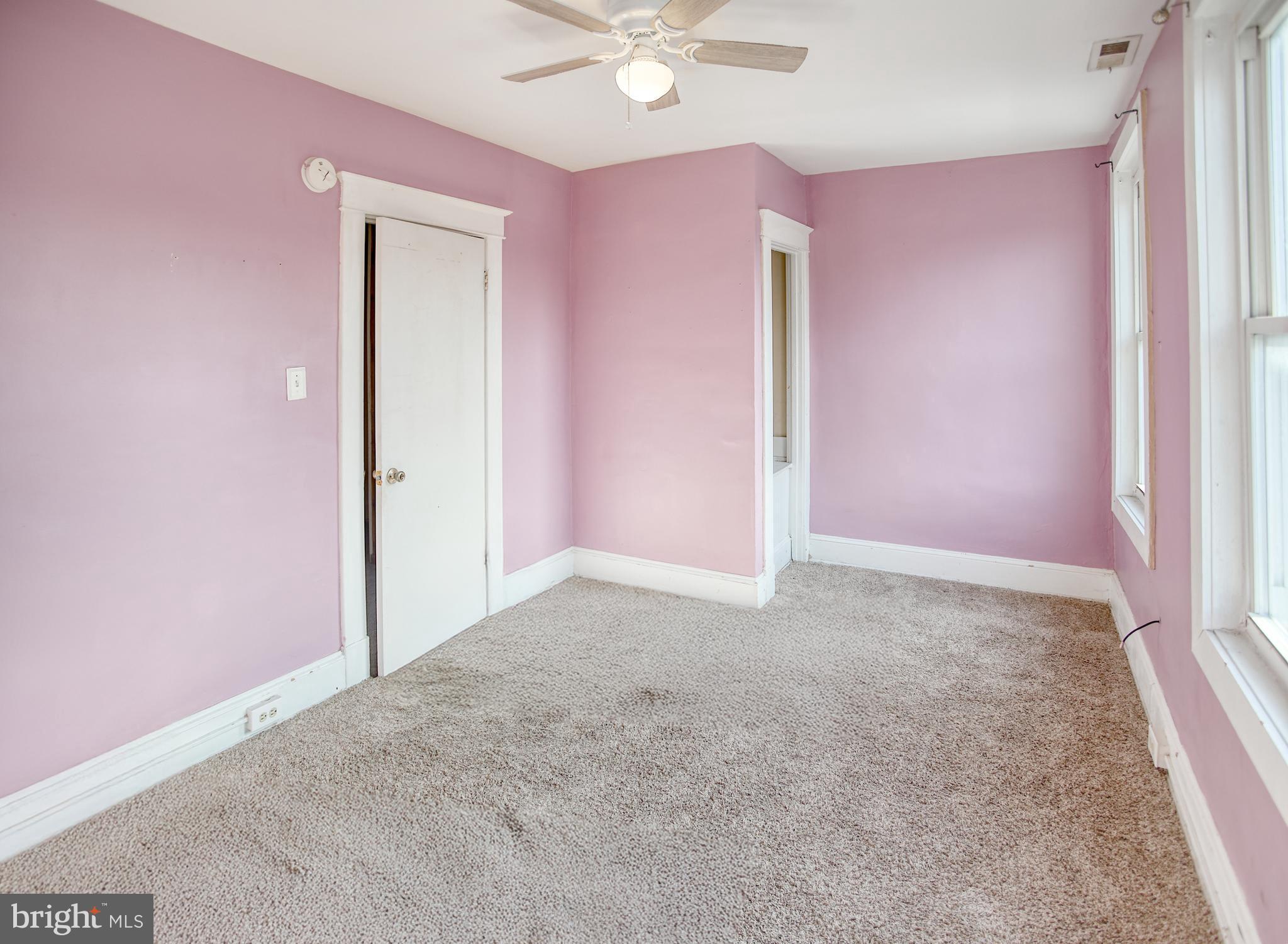 1332 Cambria Street Baltimore, MD 21225 - Photo 20 of 31 an empty room with closet and a chandelier fan