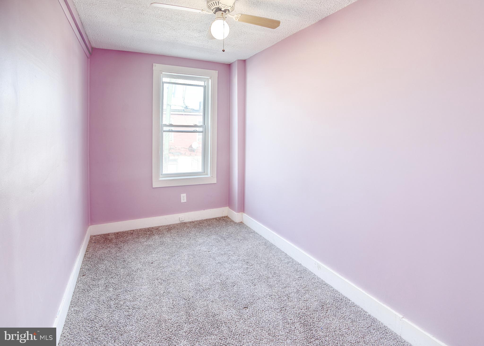 1332 Cambria Street Baltimore, MD 21225 - Photo 24 of 31 an empty room with a window