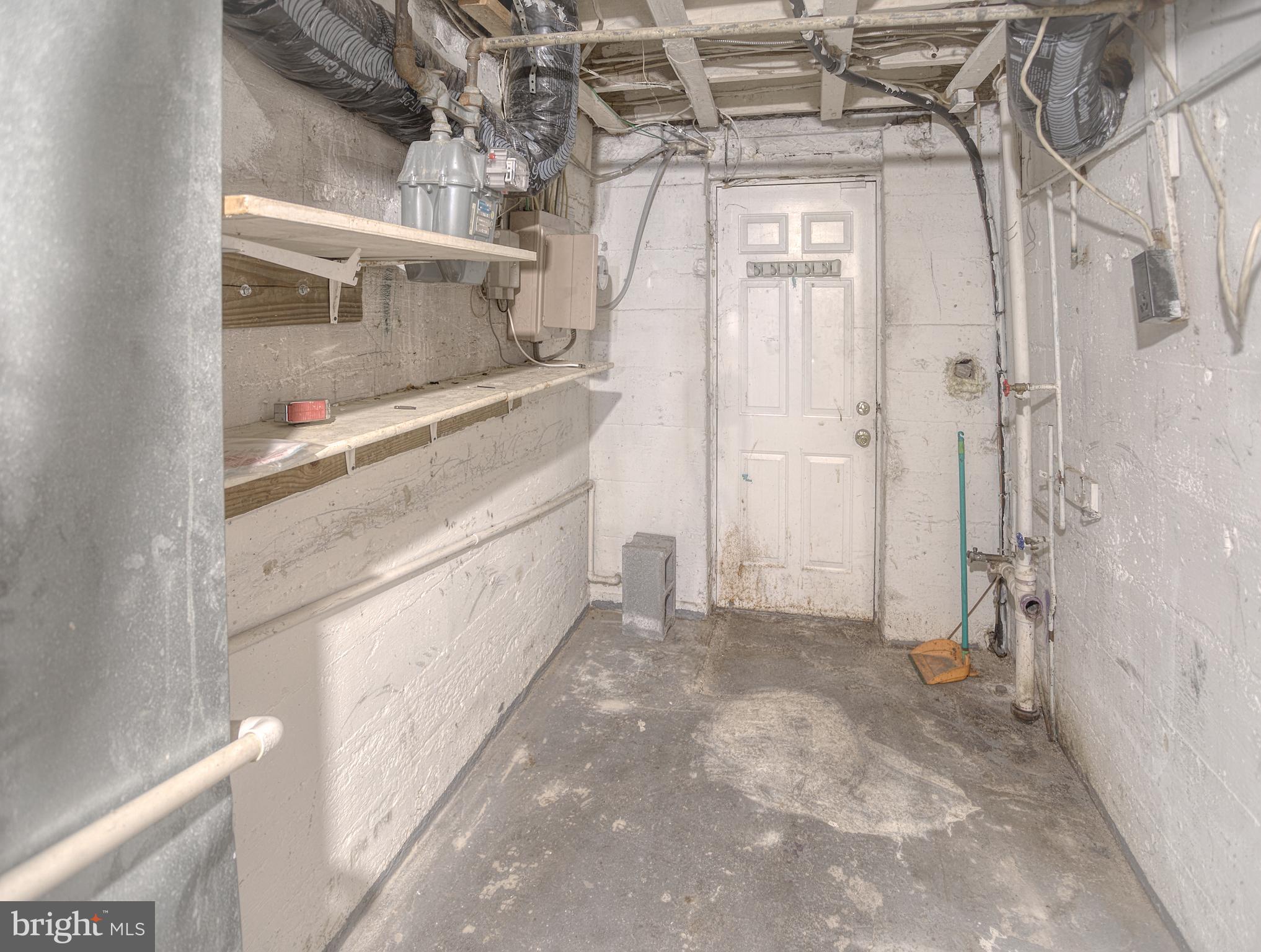 1332 Cambria Street Baltimore, MD 21225 - Photo 31 of 31 a bathroom with a double vanity sink and a mirror