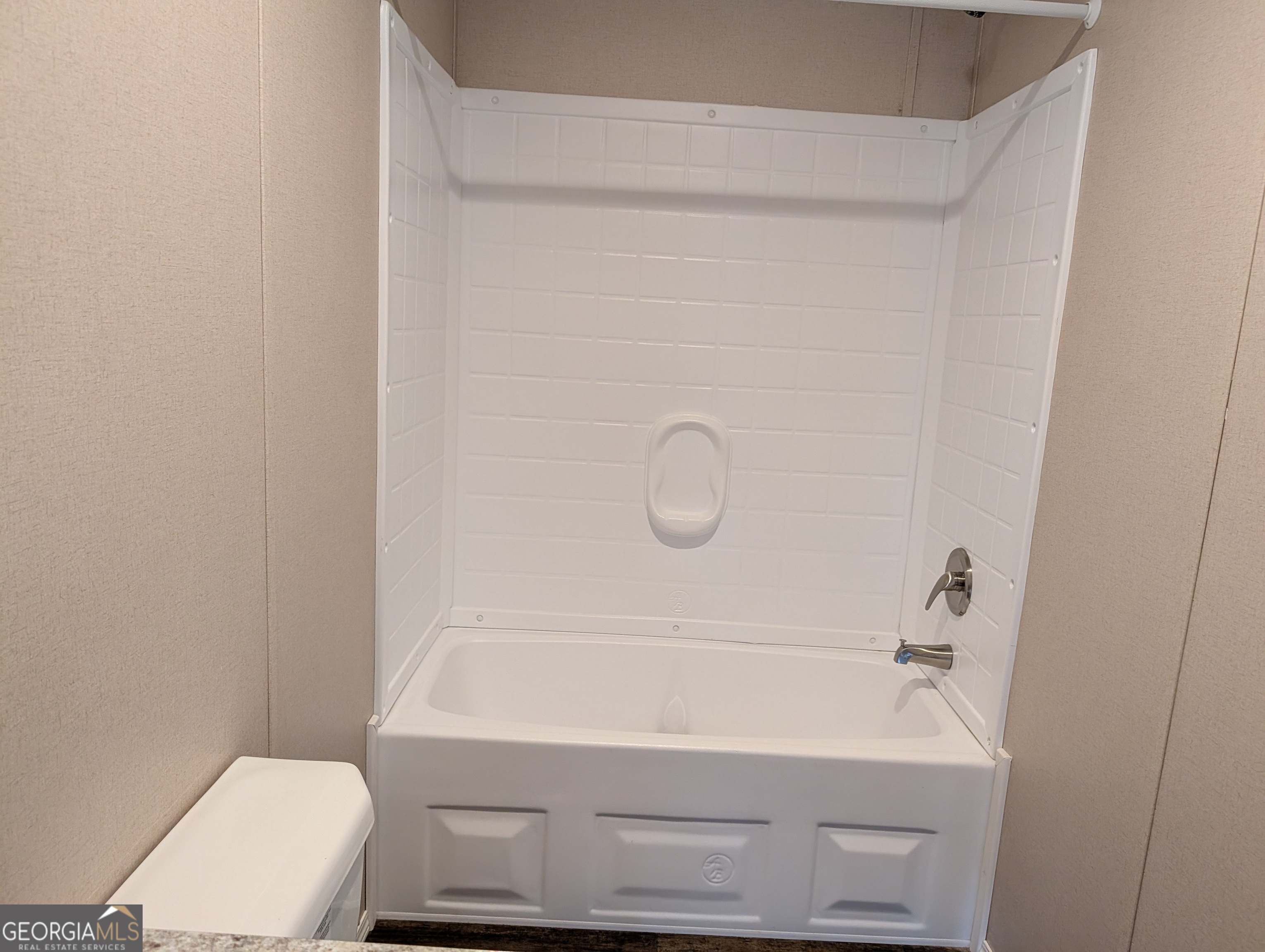 675 Fir Street Jesup, GA 31546 - Photo 18 of 22 a bathroom with a sink a toilet and a shower