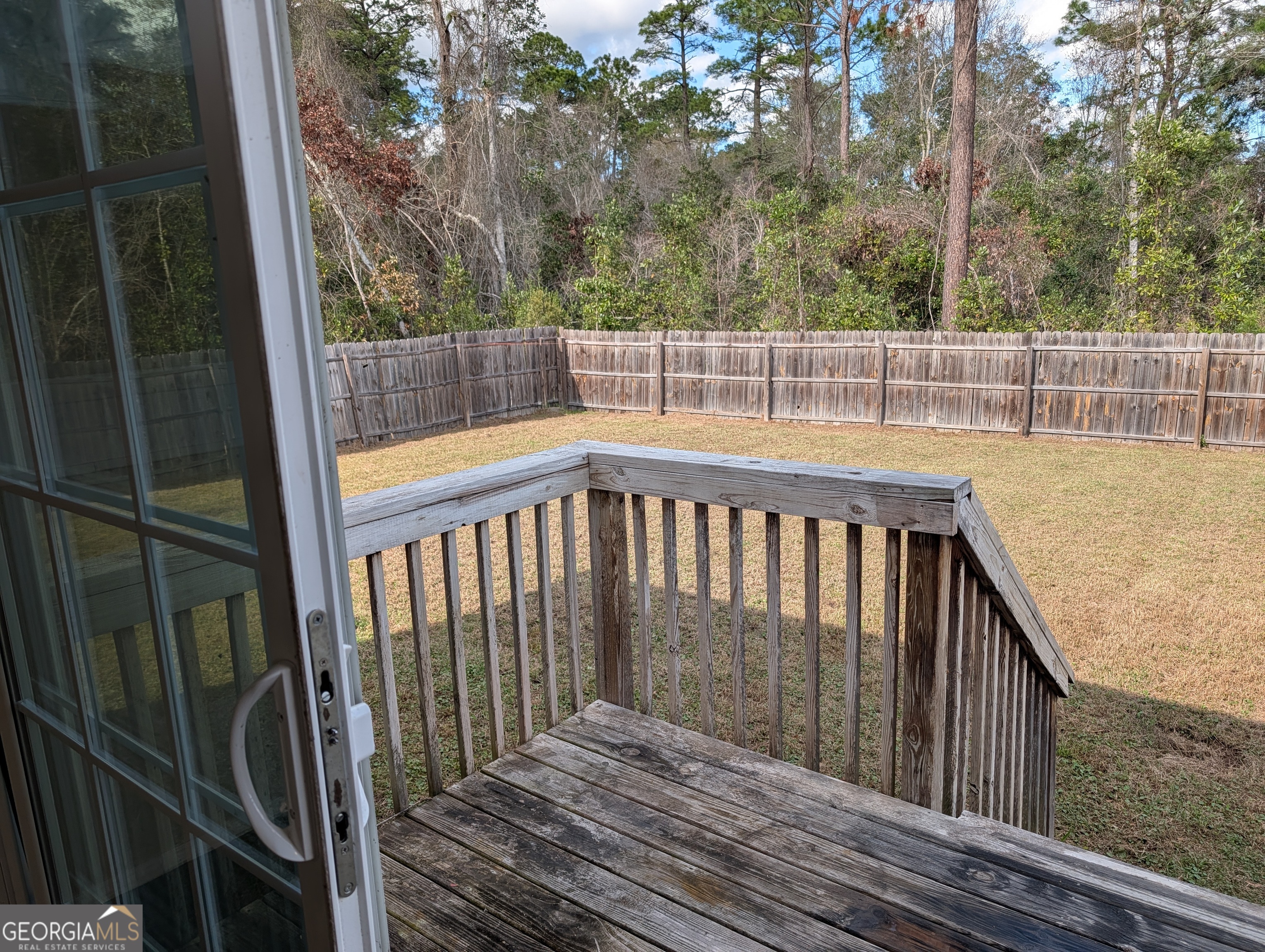 675 Fir Street Jesup, GA 31546 - Photo 5 of 22 a view of balcony with wooden floor