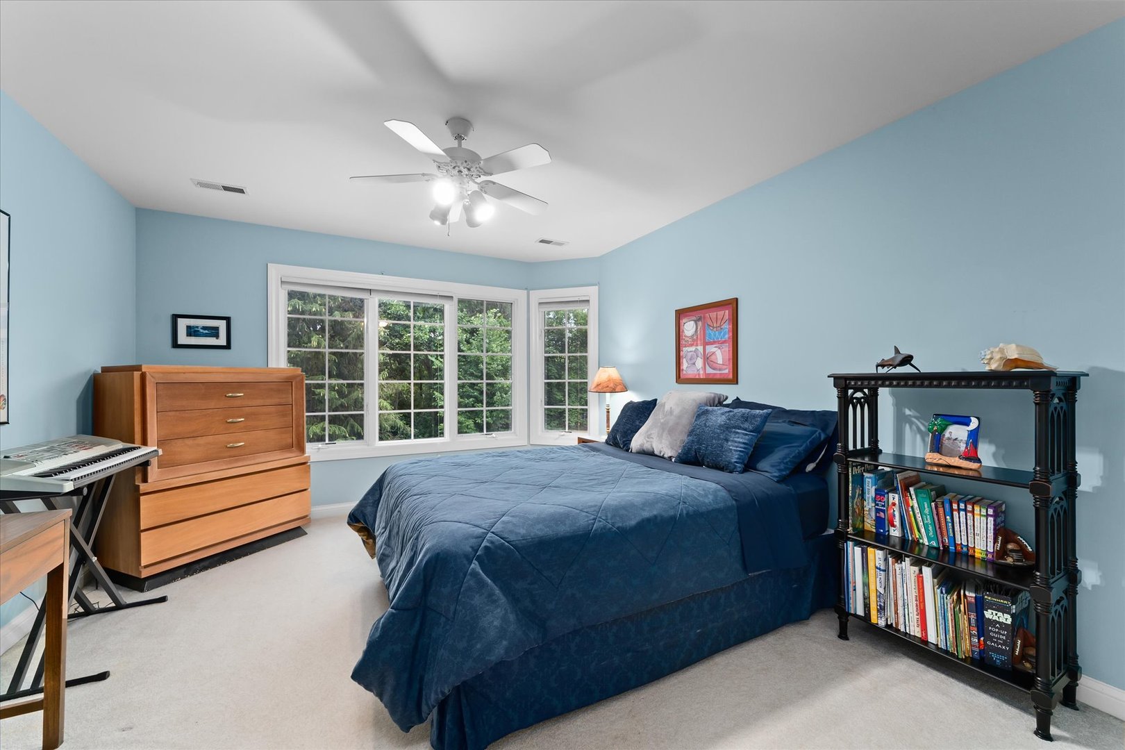 36W708 Stoneleat Road St. Charles, IL 60175 - Photo 17 of 31 a bedroom with a bed furniture and a book shelf