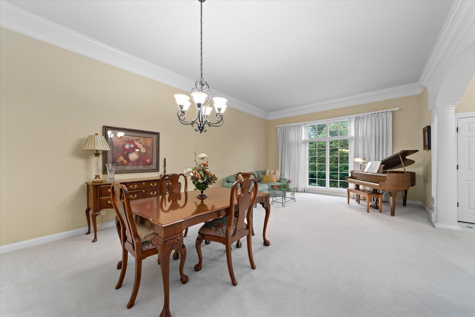 36W708 Stoneleat Road St. Charles, IL 60175 - Photo 3 of 31 a view of a dining room with furniture a chandelier and a window
