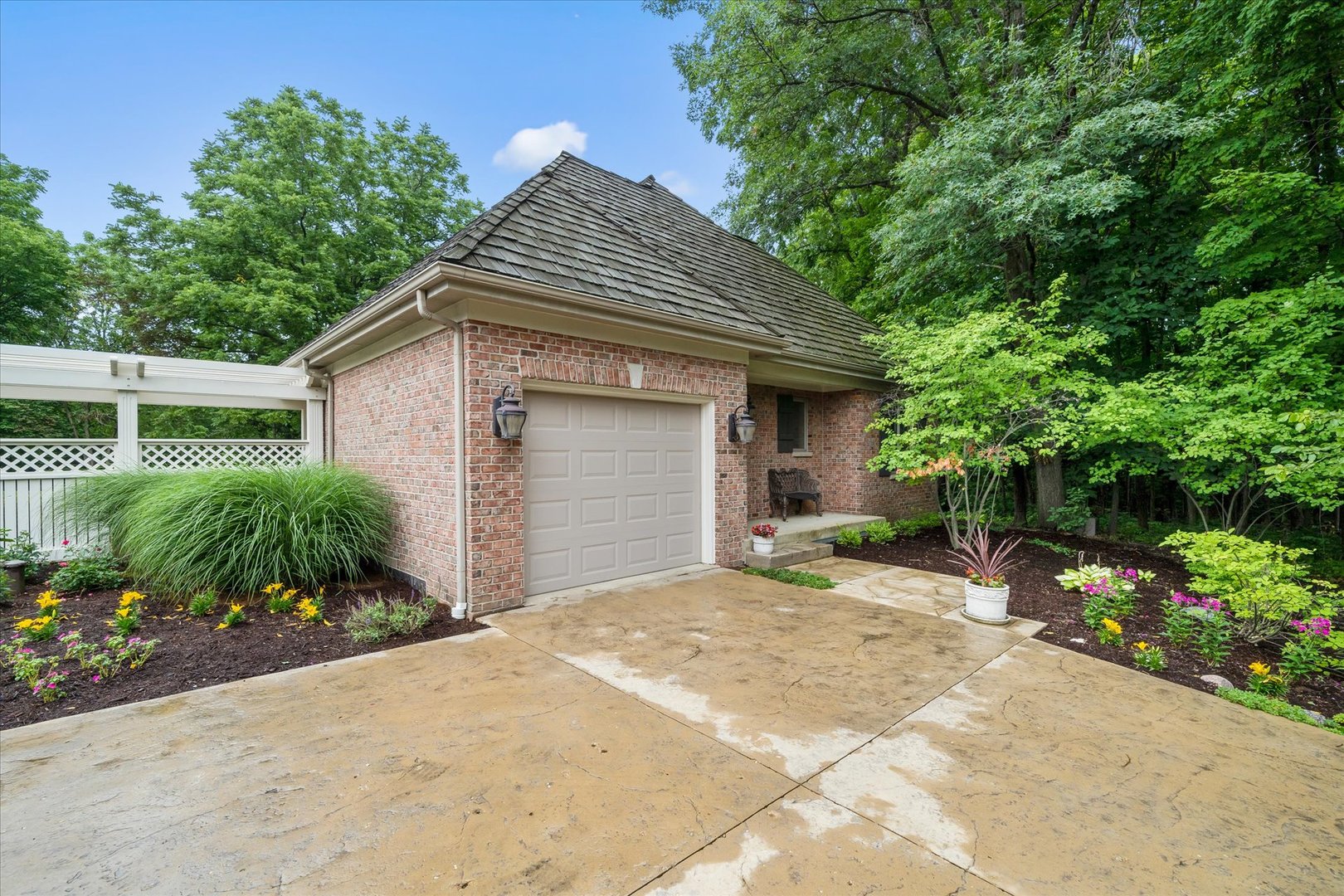 36W708 Stoneleat Road St. Charles, IL 60175 - Photo 23 of 31 a front view of a house with a yard and potted plants