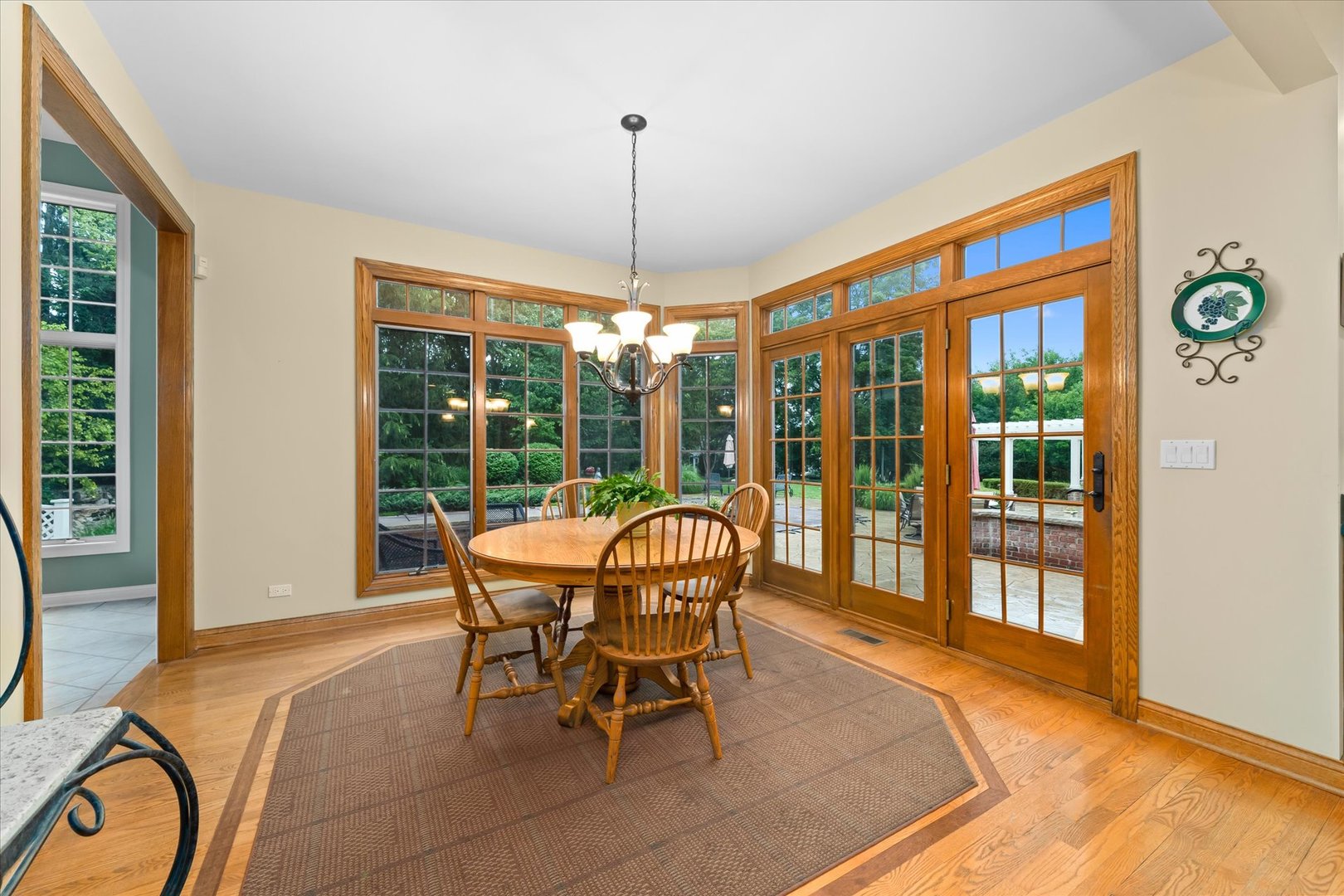 36W708 Stoneleat Road St. Charles, IL 60175 - Photo 8 of 31 a dining room with furniture a chandelier and wooden floor