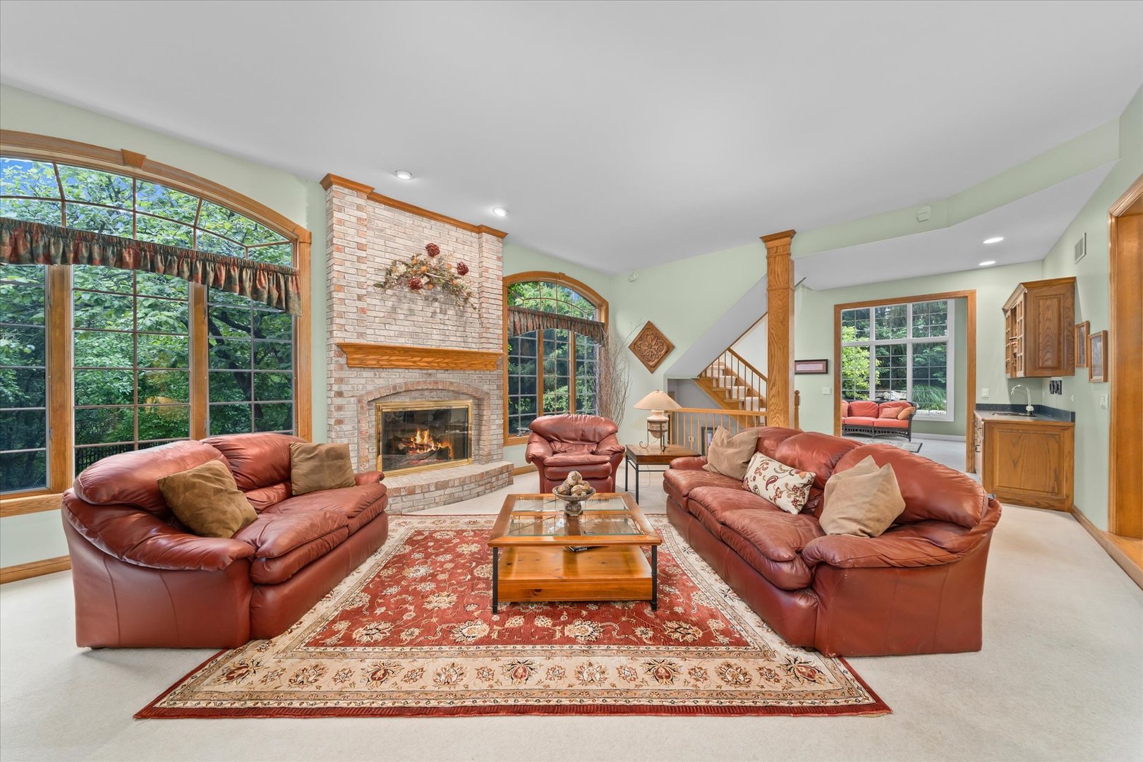 36W708 Stoneleat Road St. Charles, IL 60175 - Photo 9 of 31 a living room with furniture windows and a fireplace