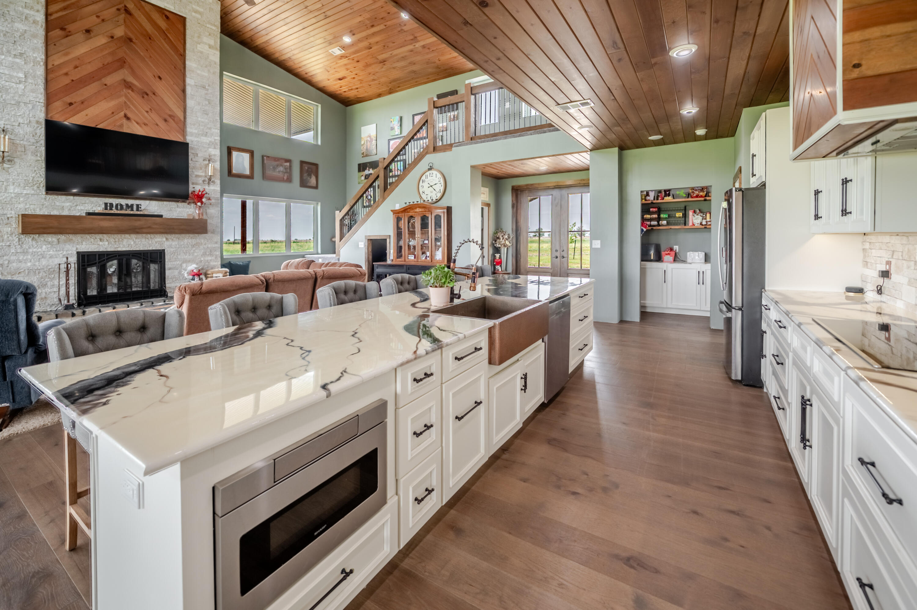 6792 Maine Road Anton, TX 79313 - Photo 73 of 77 a large white kitchen with a stove and a sink