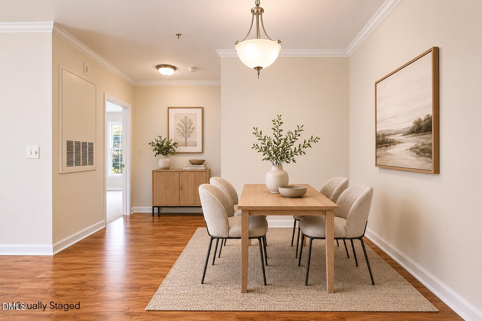 801 Moratuck Drive, Unit 202 Raleigh, NC 27604 - Photo 7 of 23 a view of a dining room with furniture wooden floor and a chandelier