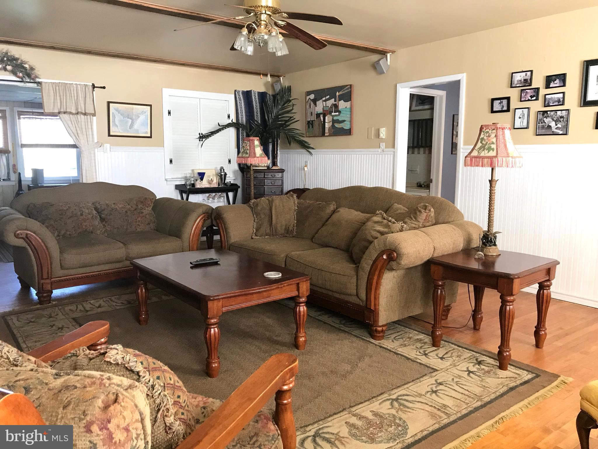 4416 Whalerman Road Brigantine, NJ 08203 - Photo 11 of 22 a living room with furniture and a rug