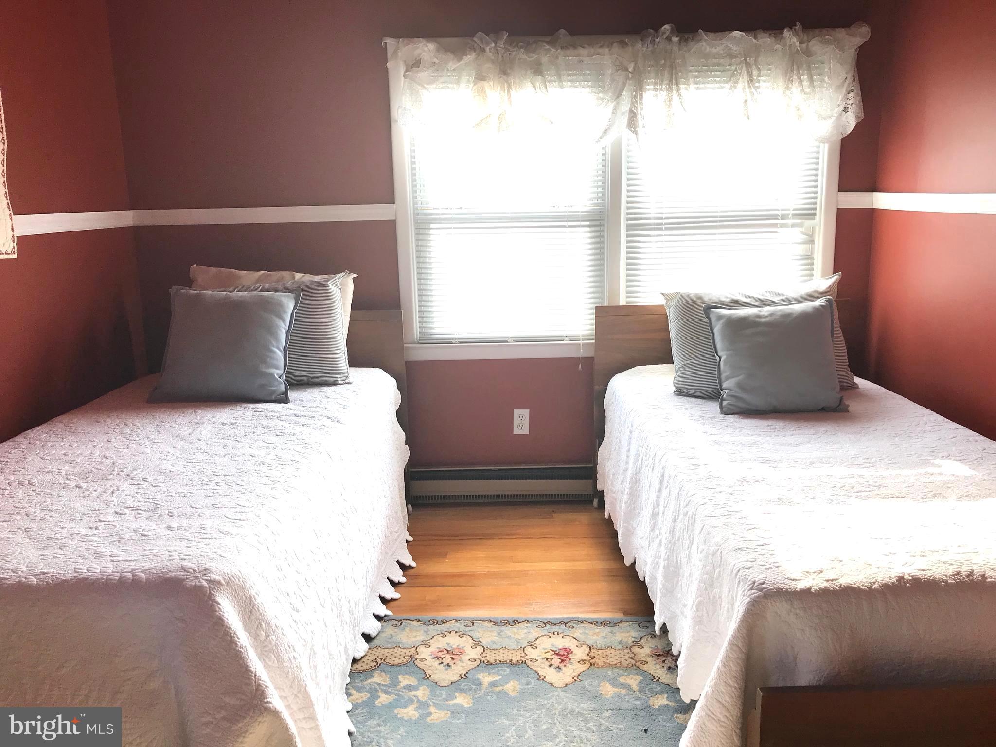 4416 Whalerman Road Brigantine, NJ 08203 - Photo 15 of 22 a bedroom with a bed and a window