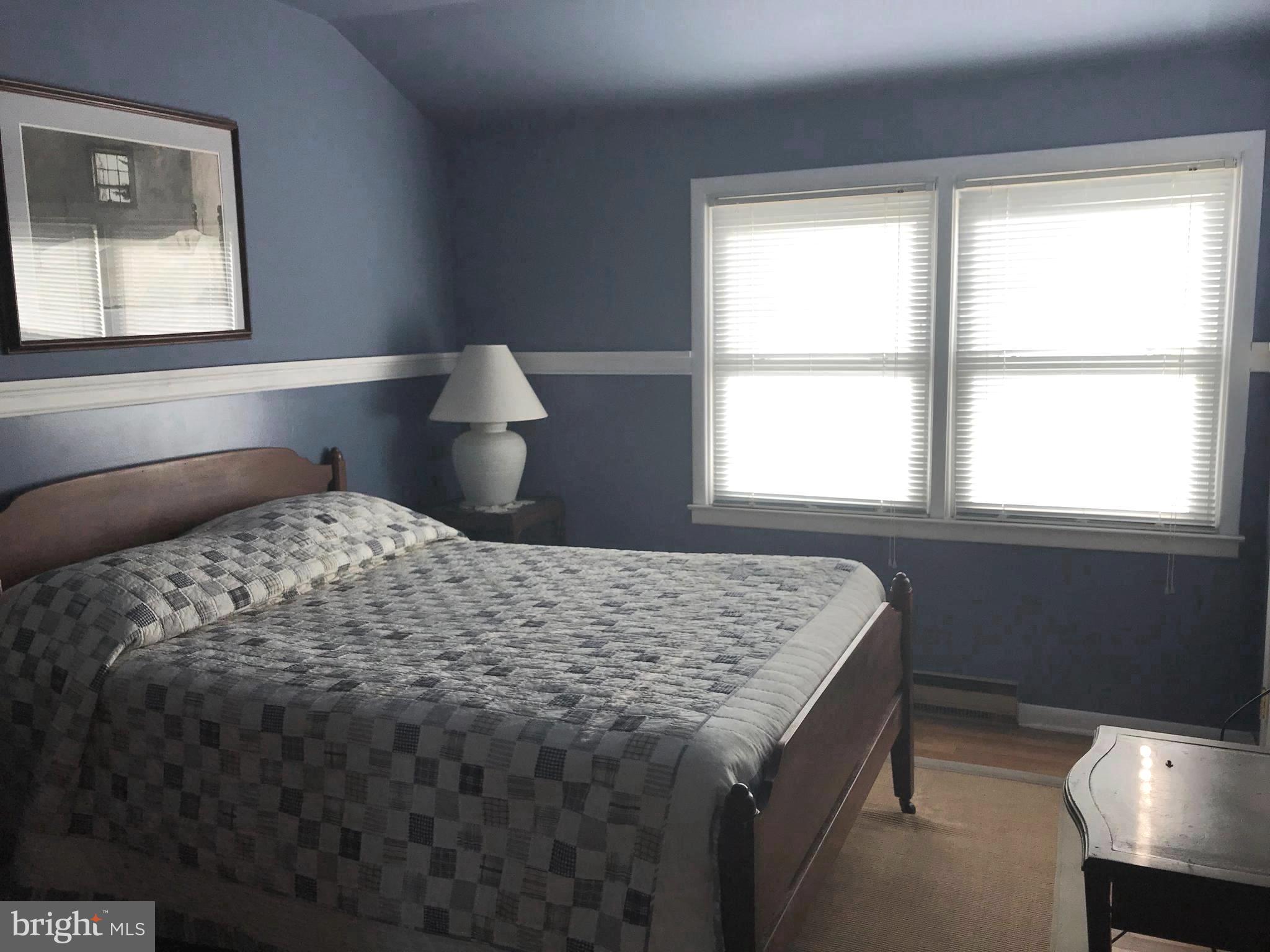 4416 Whalerman Road Brigantine, NJ 08203 - Photo 17 of 22 a bedroom with a bed and a window