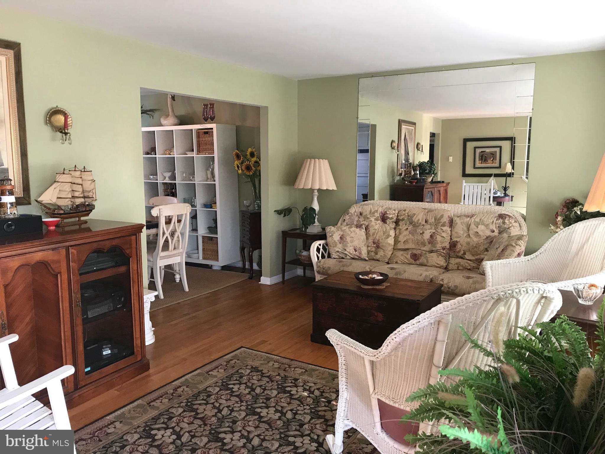 4416 Whalerman Road Brigantine, NJ 08203 - Photo 5 of 22 a living room with furniture lamp and rug