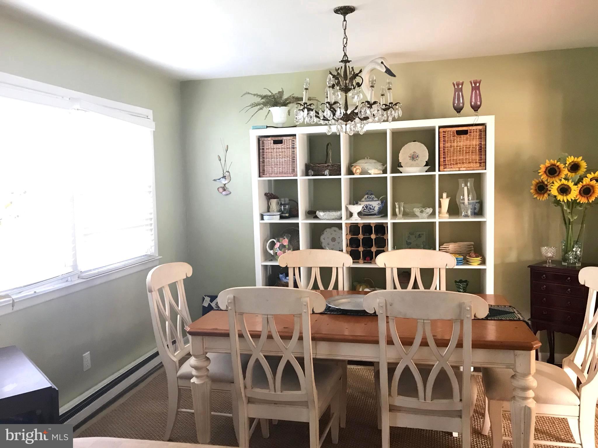 4416 Whalerman Road Brigantine, NJ 08203 - Photo 8 of 22 a view of a dining room with furniture and chandelier