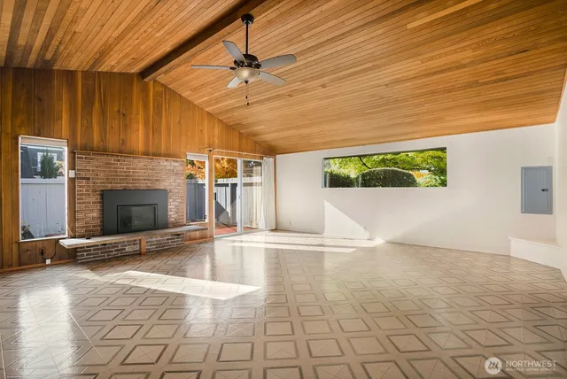 a view of an empty room with a fireplace