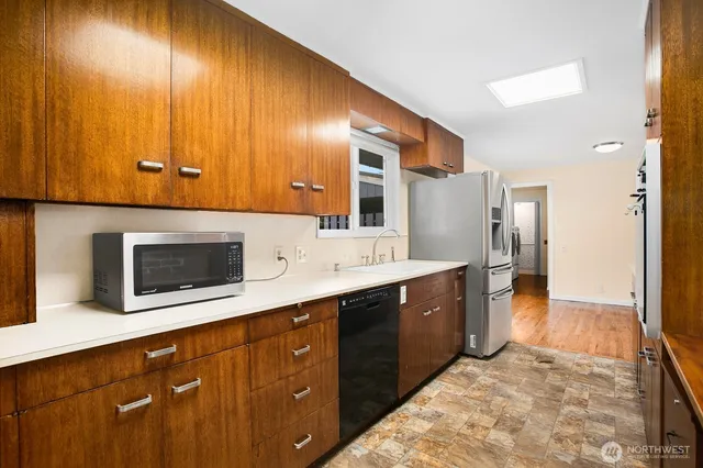 a spacious bathroom with a sink and a large mirror