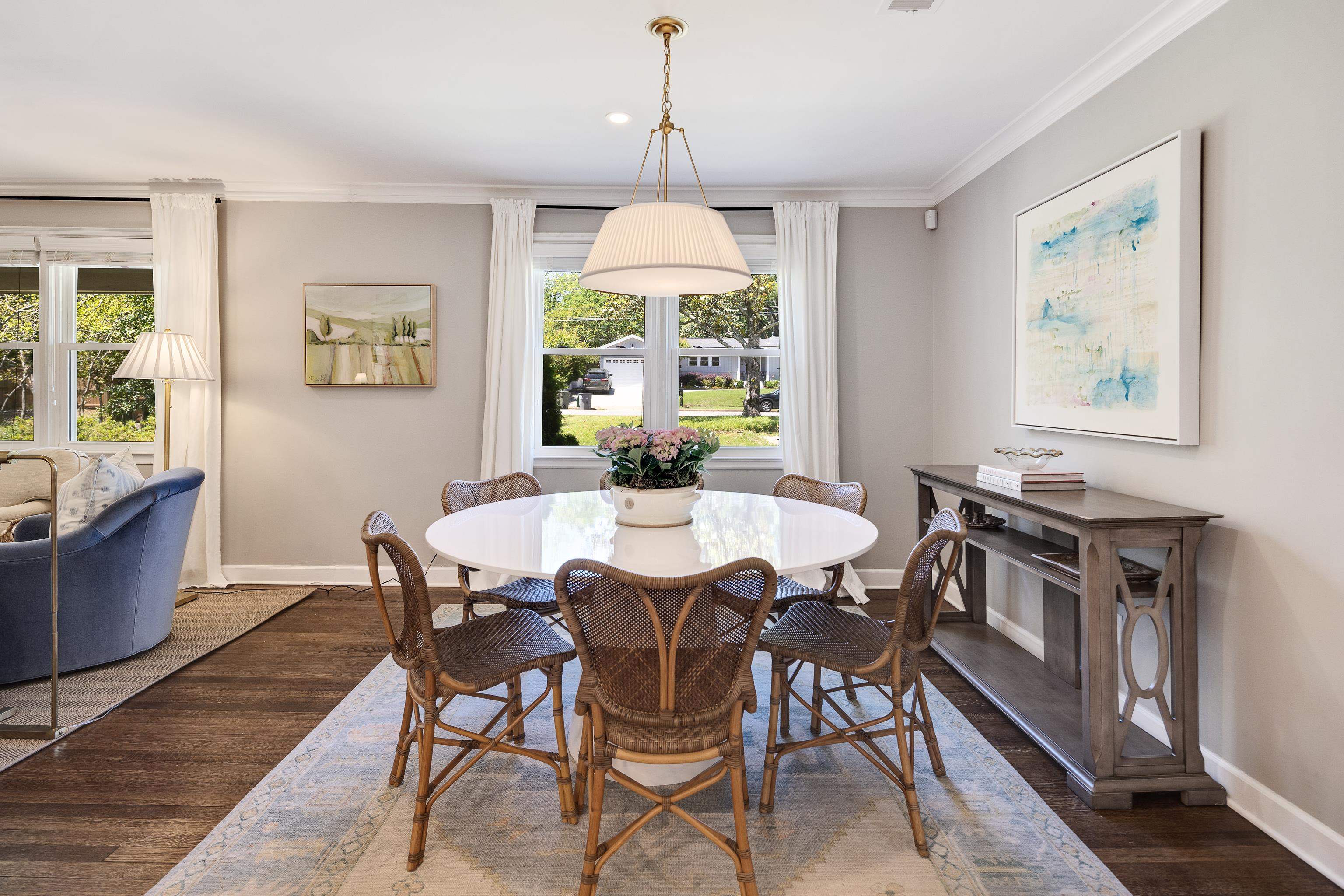 168 Avon Road Memphis, TN 38117 - Photo 12 of 38 a dining room with furniture a chandelier and wooden floor