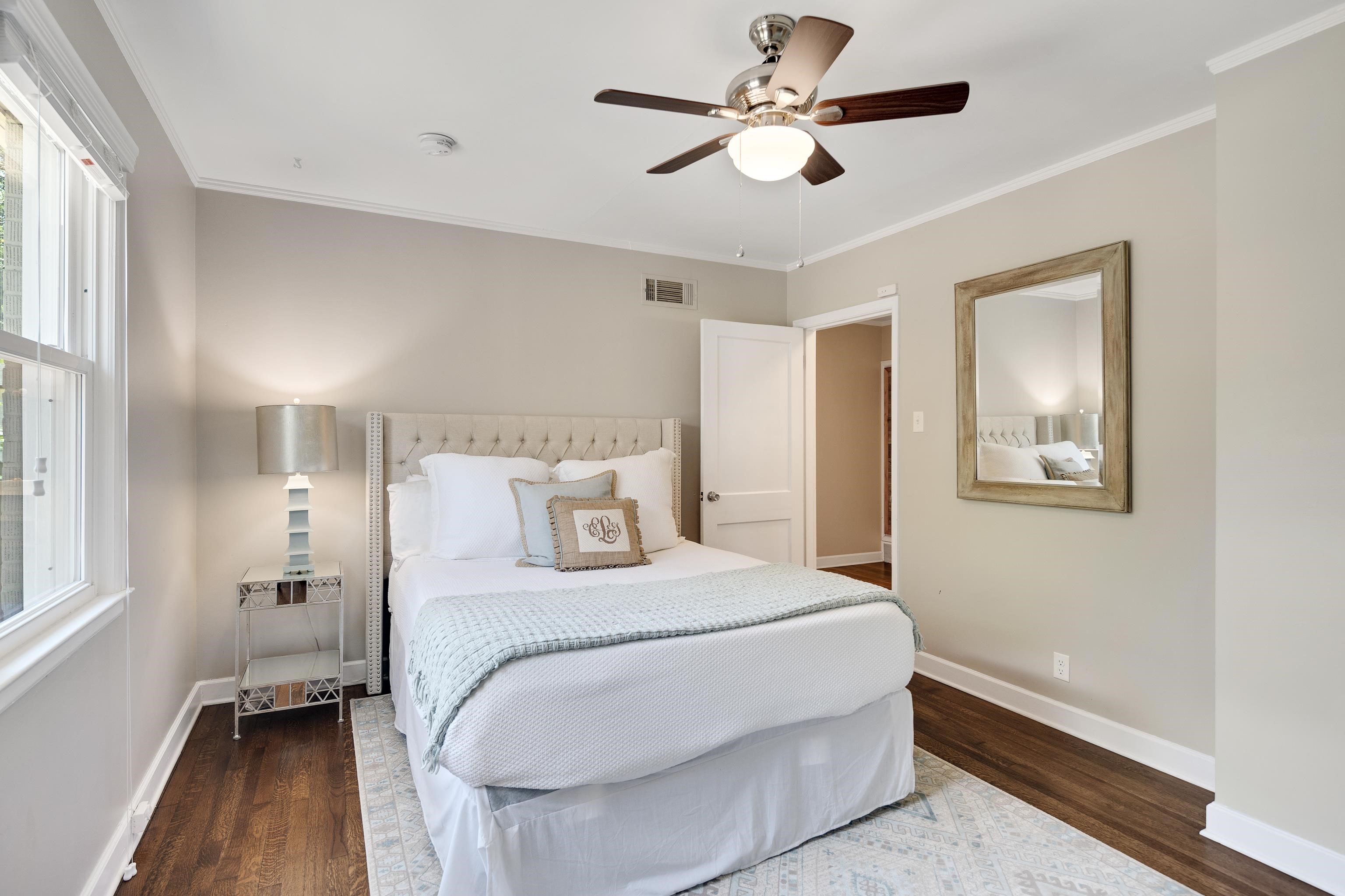 168 Avon Road Memphis, TN 38117 - Photo 24 of 38 a bedroom with a large bed and a ceiling fan