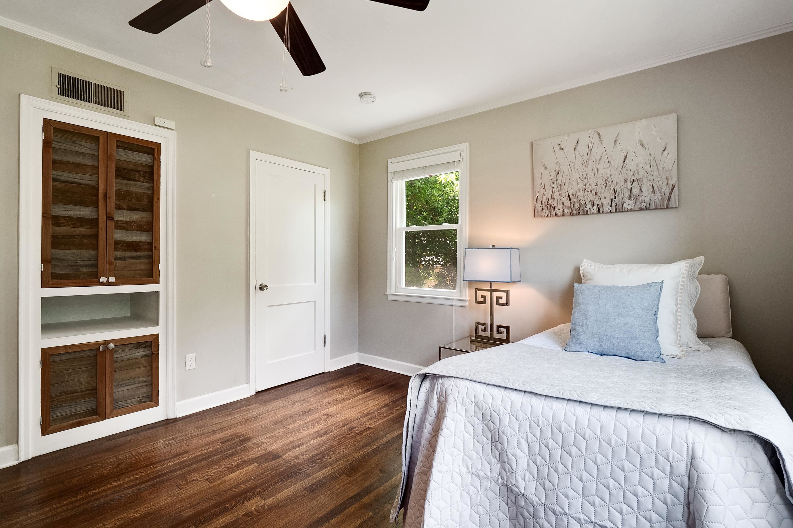 168 Avon Road Memphis, TN 38117 - Photo 27 of 38 a bedroom with a large bed and a window