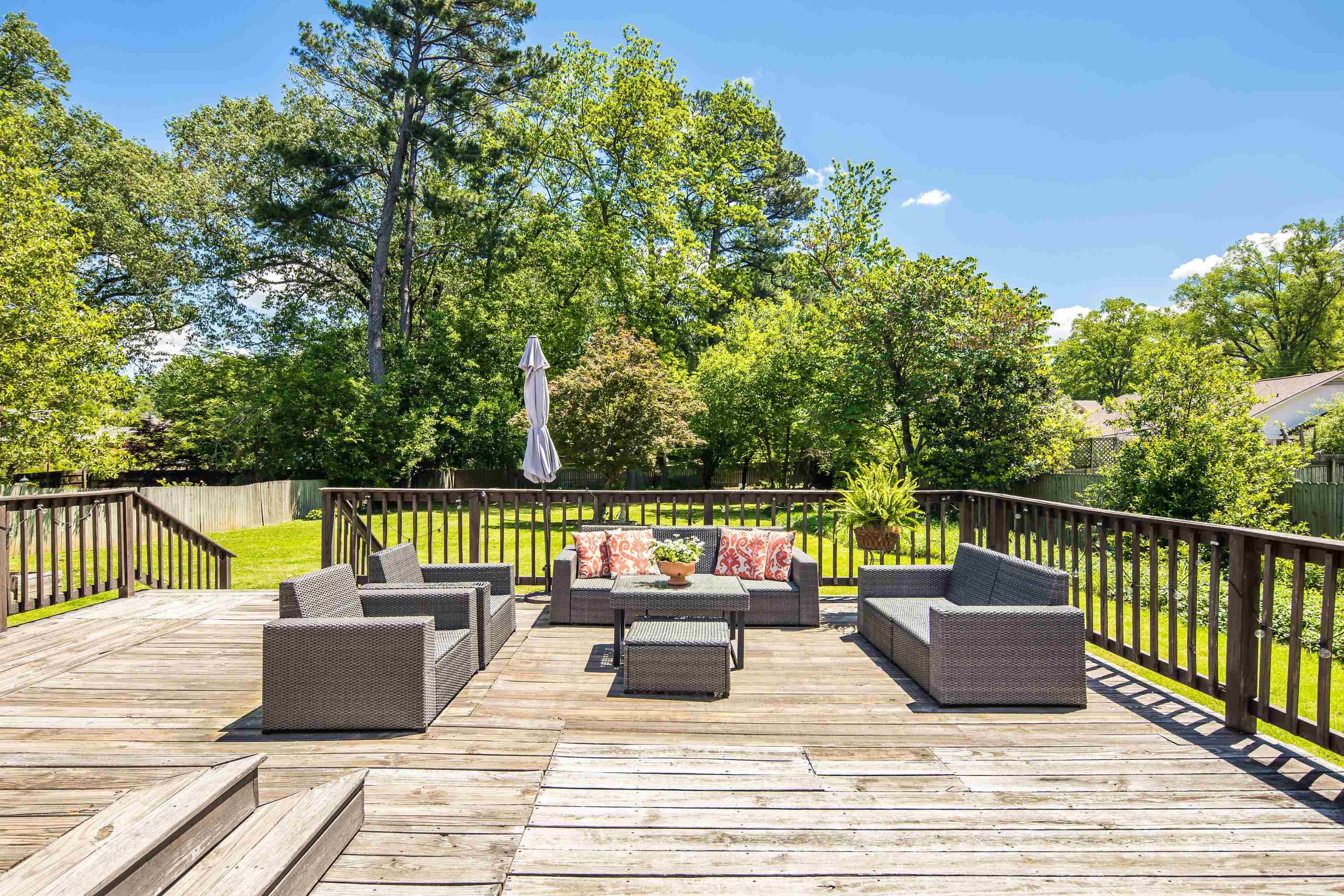 168 Avon Road Memphis, TN 38117 - Photo 32 of 38 a view of a deck with couches chairs and wooden floor