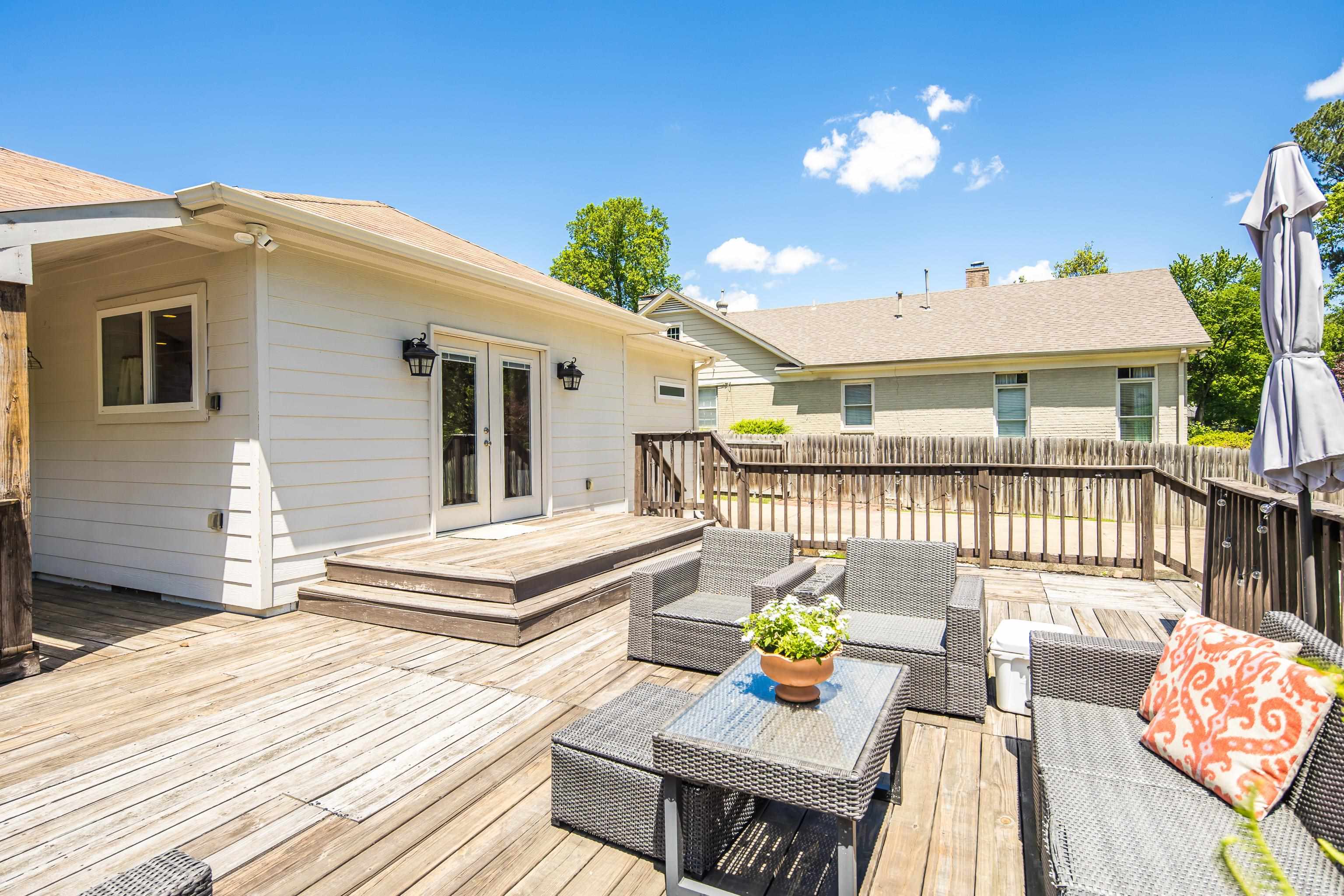 168 Avon Road Memphis, TN 38117 - Photo 33 of 38 a view of a patio with couches table and chairs and potted plants