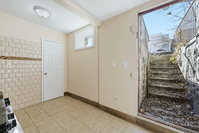 a view of an entryway with wooden floor