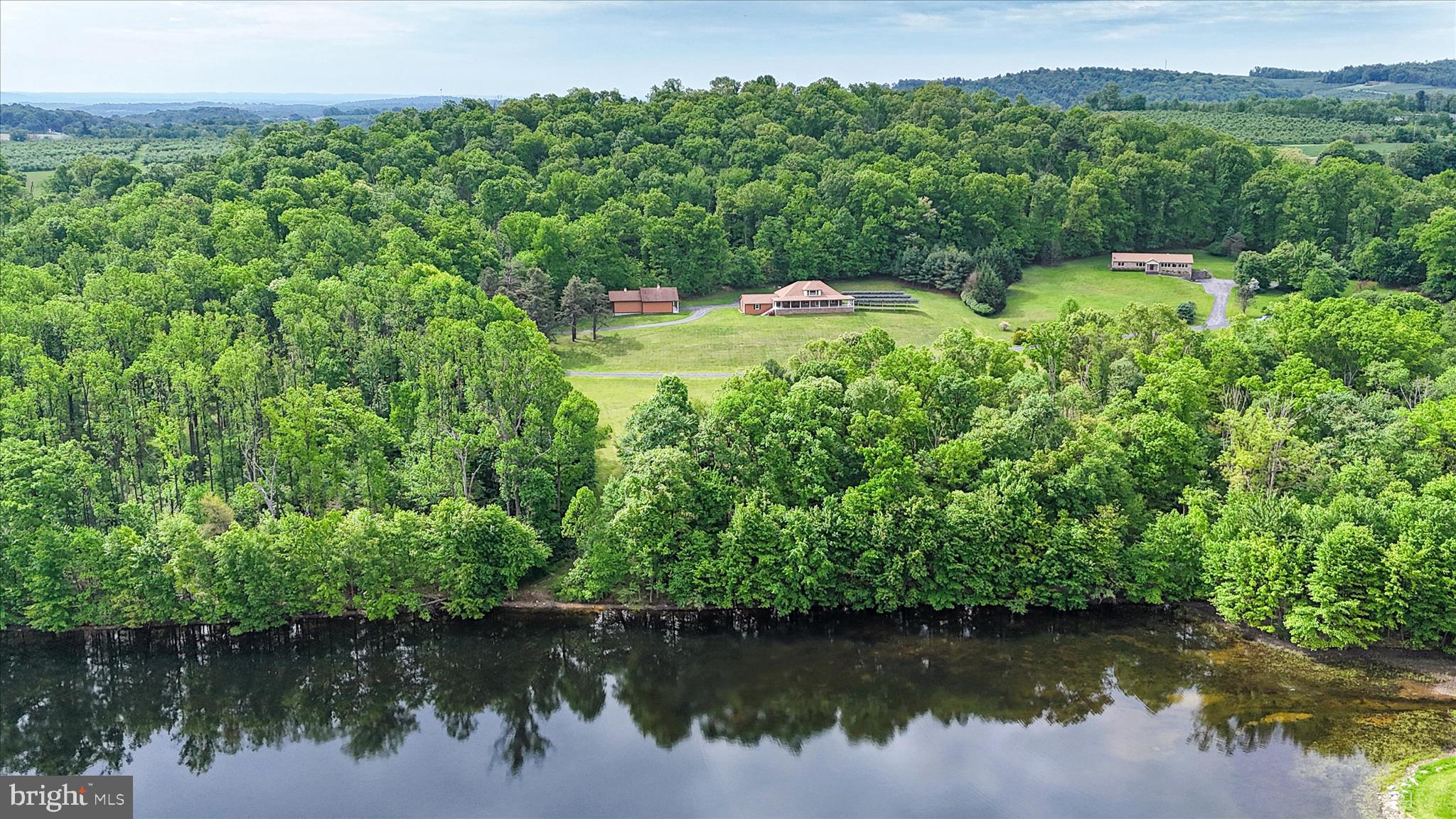 98 Peach Glen Road Gardners, PA 17324 - Photo 79 of 85 a view of a lake with a house in the background