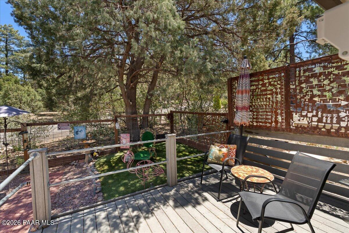 1388 East Pine Ridge Drive Prescott, AZ 86303 - Photo 4 of 16 a view of a chairs and table on the wooden floor