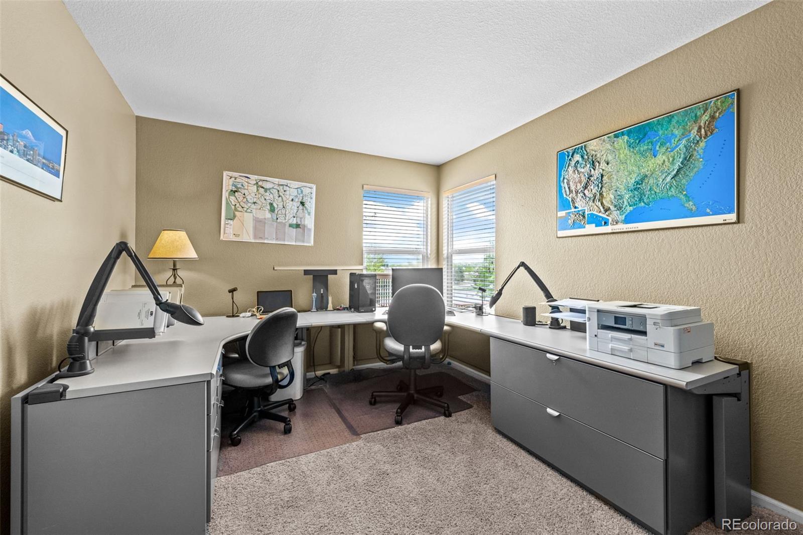 1735 Spring Water Lane Highlands Ranch, CO 80129 - Photo 24 of 50 a view of a workspace with furniture and a window