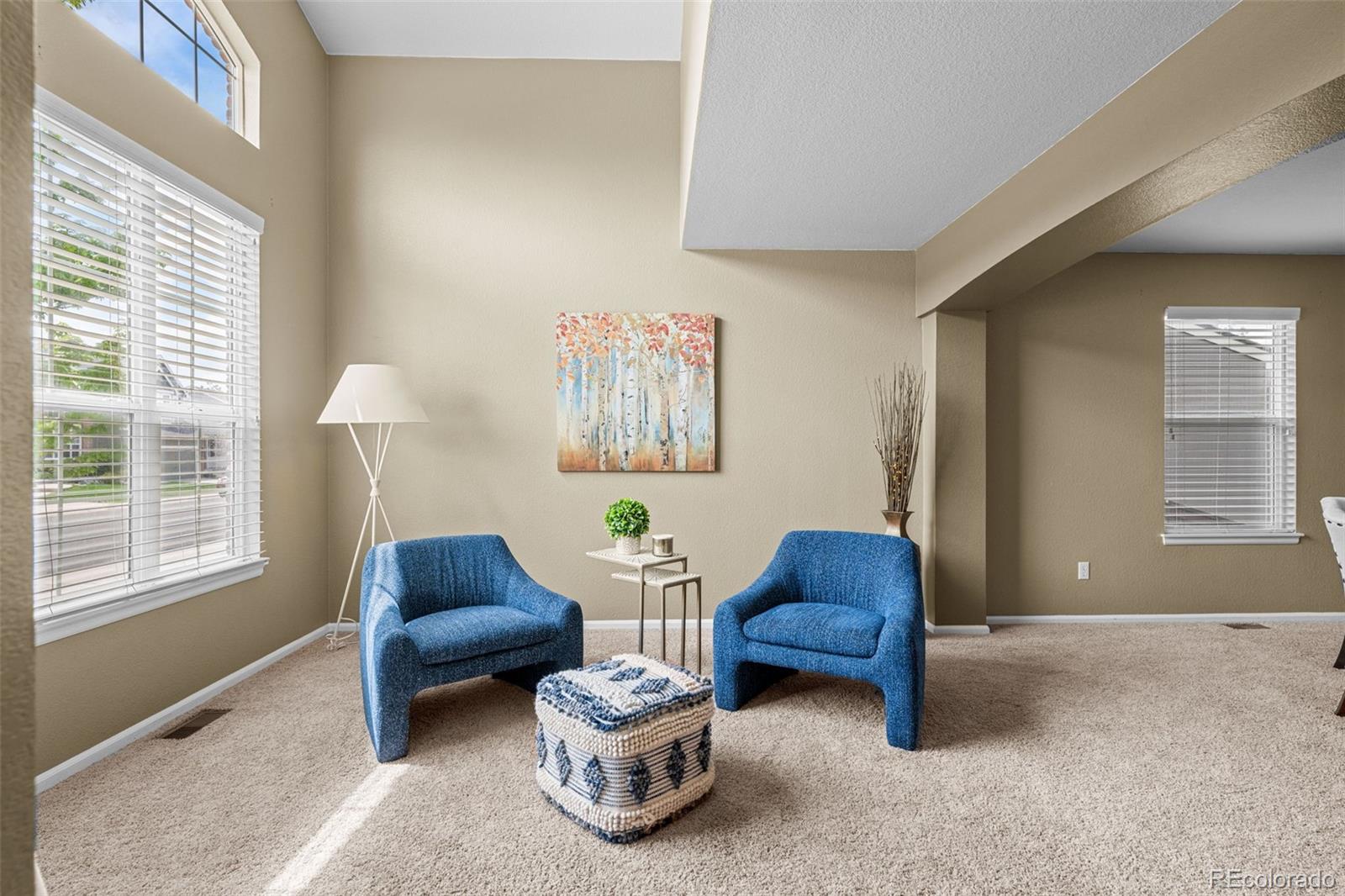1735 Spring Water Lane Highlands Ranch, CO 80129 - Photo 4 of 50 a living room with furniture and a window