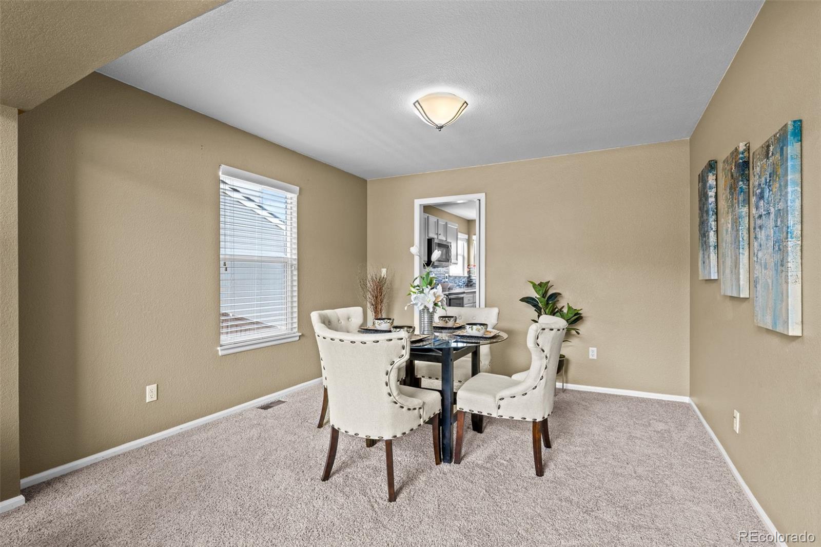 1735 Spring Water Lane Highlands Ranch, CO 80129 - Photo 8 of 50 a dining room with furniture and window
