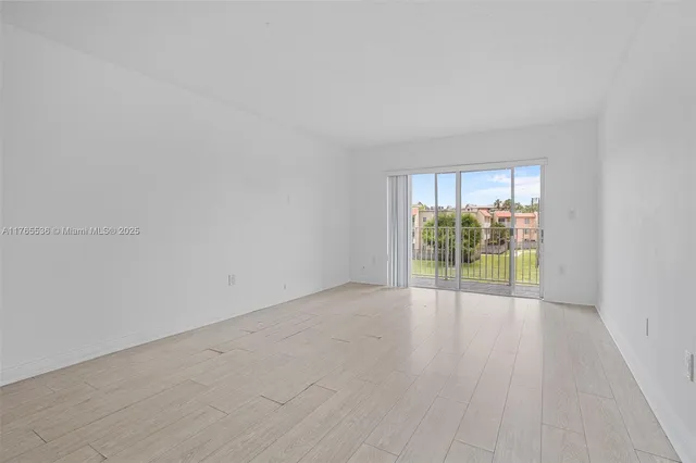 a view of kitchen with wooden floor