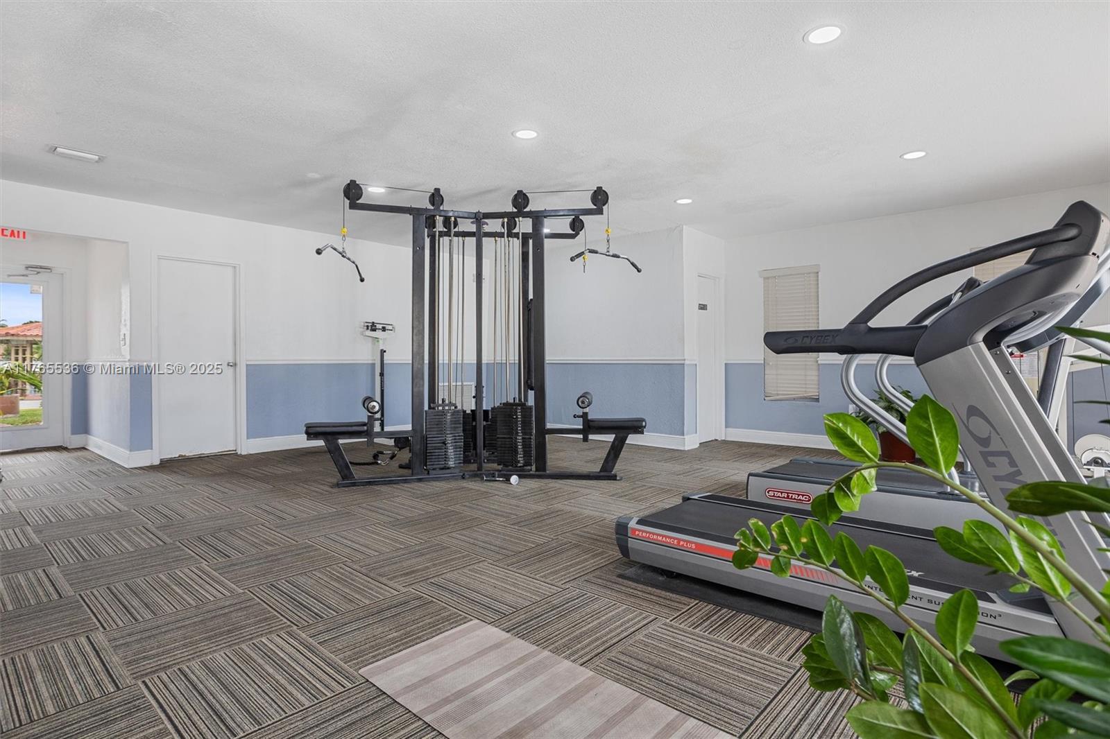 4920 Northwest 79th Avenue, Unit 309 Doral, FL 33166 - Photo 19 of 33 a bedroom with furniture and a wooden floor