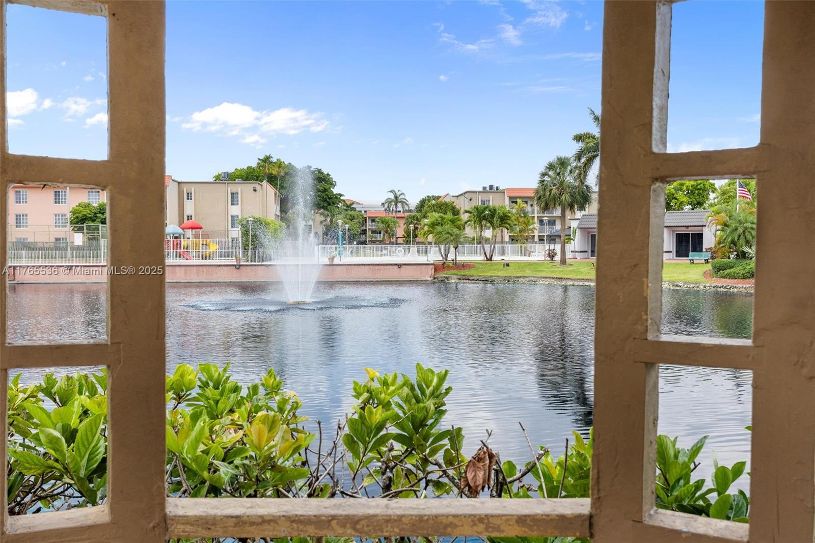 4920 Northwest 79th Avenue, Unit 309 Doral, FL 33166 - Photo 20 of 33 a view of a lake from a balcony