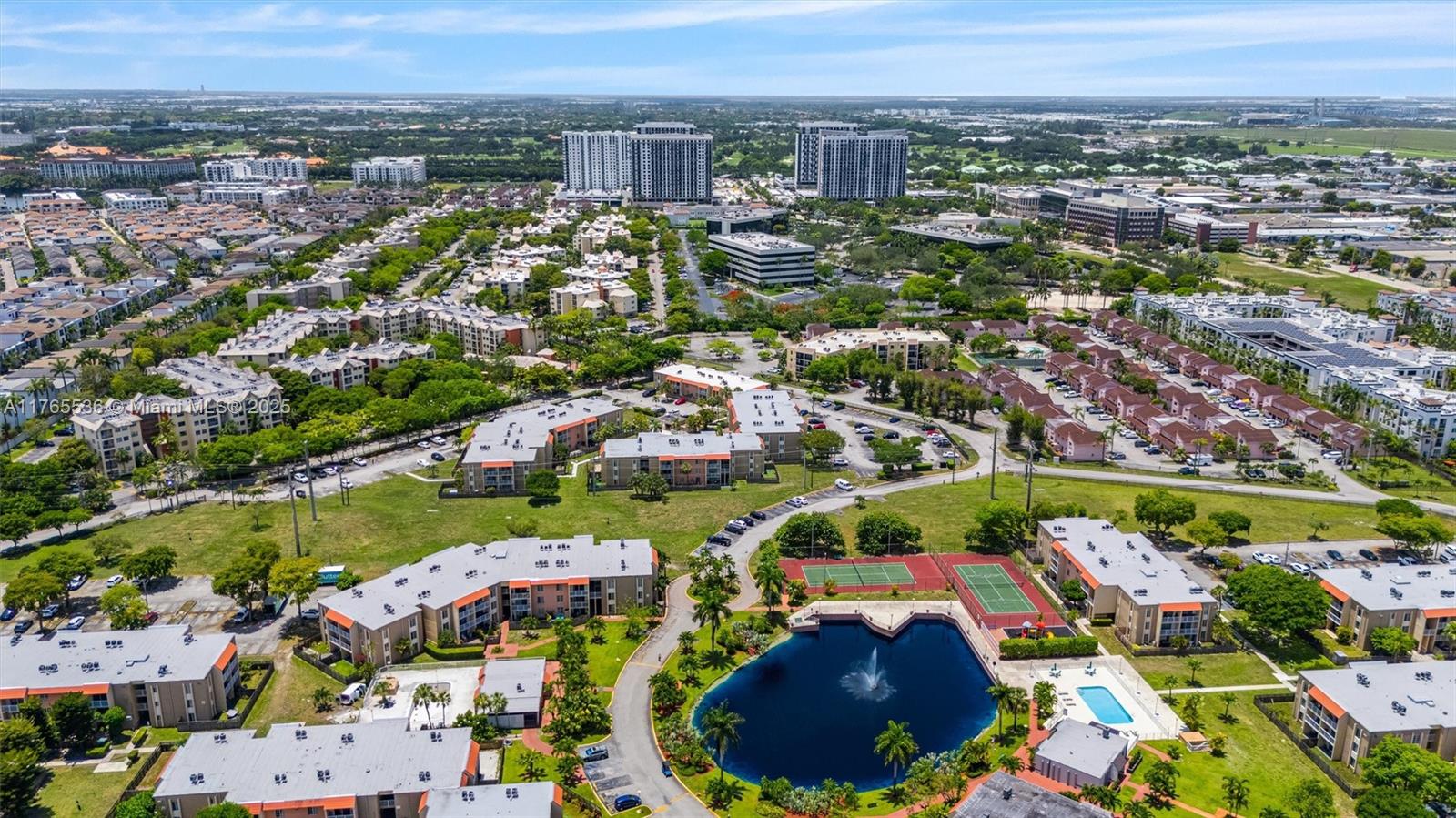 4920 Northwest 79th Avenue, Unit 309 Doral, FL 33166 - Photo 25 of 33 an aerial view of residential houses with outdoor space