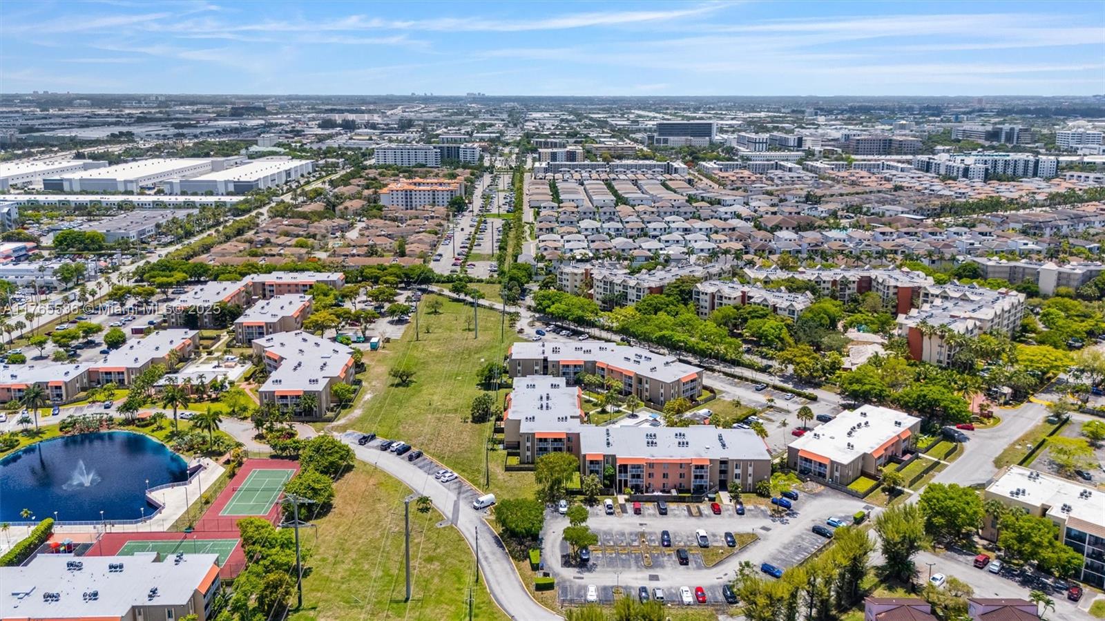4920 Northwest 79th Avenue, Unit 309 Doral, FL 33166 - Photo 29 of 33 an aerial view of residential houses with outdoor space