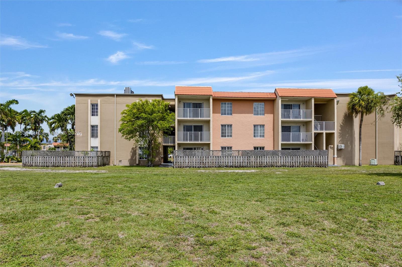 4920 Northwest 79th Avenue, Unit 309 Doral, FL 33166 - Photo 3 of 33 a view of a house with a yard