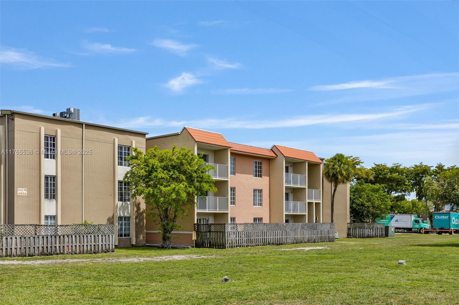4920 Northwest 79th Avenue, Unit 309 Doral, FL 33166 - Photo 4 of 33 a front view of house with yard and green space