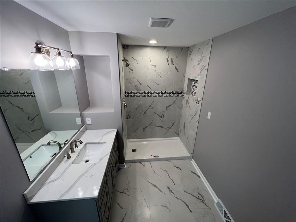945 McElree Road Washington, PA 15301 - Photo 11 of 16 a bathroom with a sink a toilet and shower