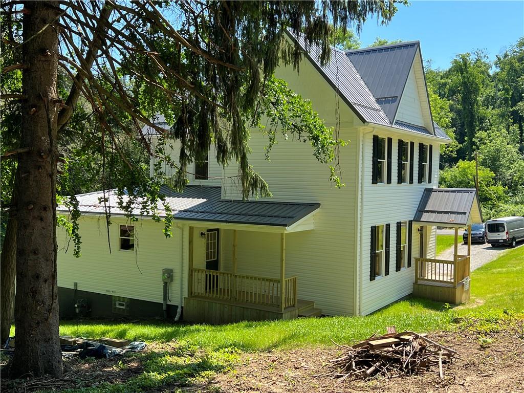 945 McElree Road Washington, PA 15301 - Photo 3 of 16 a view of a house with a backyard