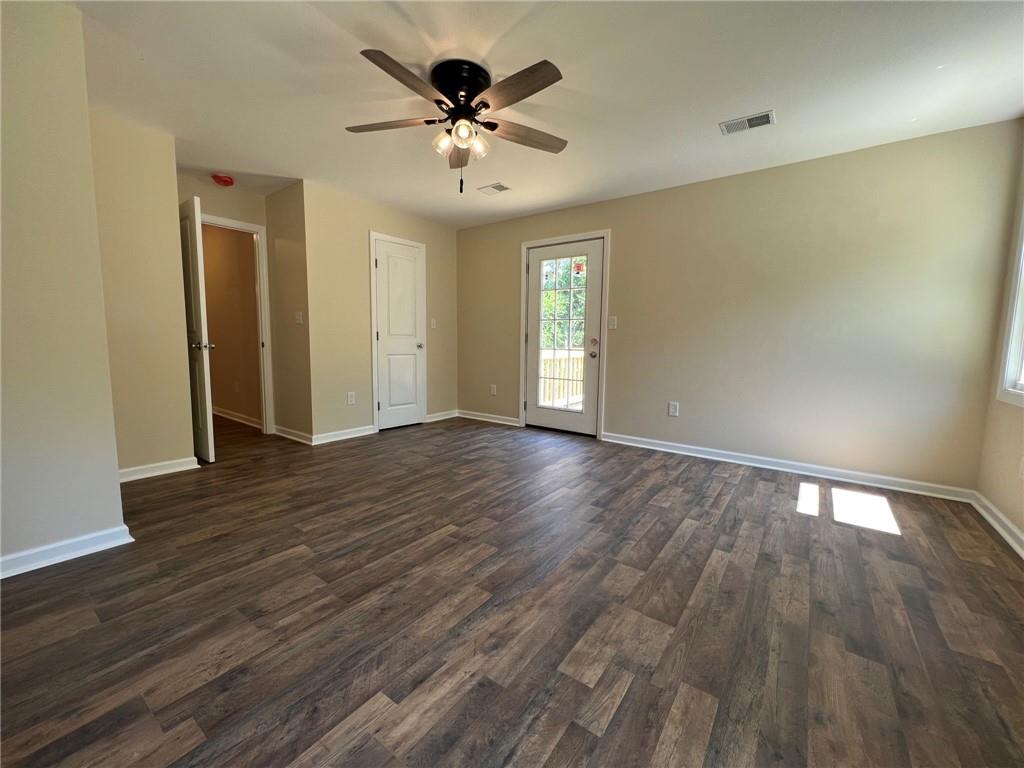 945 McElree Road Washington, PA 15301 - Photo 10 of 16 a view of an empty room with wooden floor and a ceiling fan