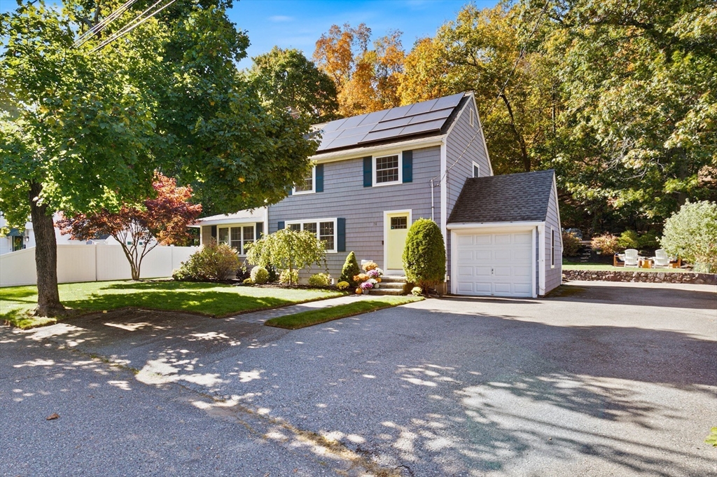 31 Robert Street Wakefield, MA 01880 - Photo 1 of 41 a front view of a house with yard and green space
