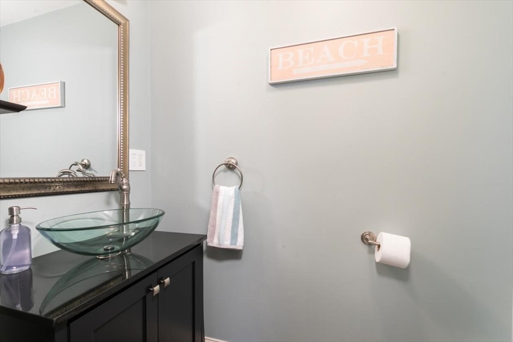 31 Robert Street Wakefield, MA 01880 - Photo 11 of 41 a bathroom with a sink and a mirror