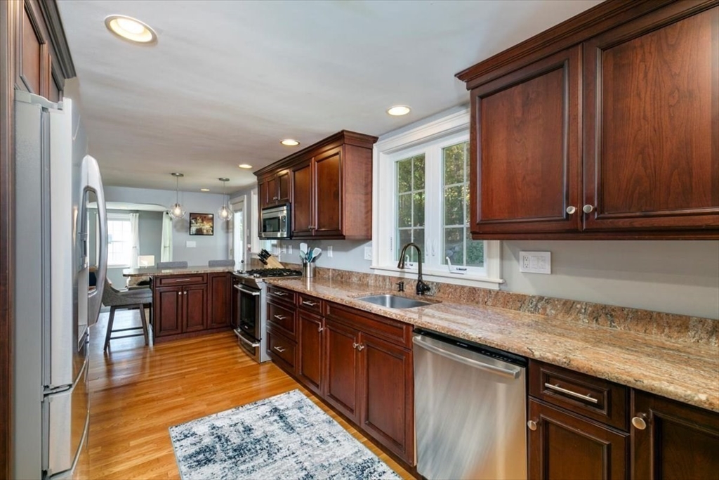 31 Robert Street Wakefield, MA 01880 - Photo 14 of 41 a kitchen with stainless steel appliances granite countertop sink stove and microwave