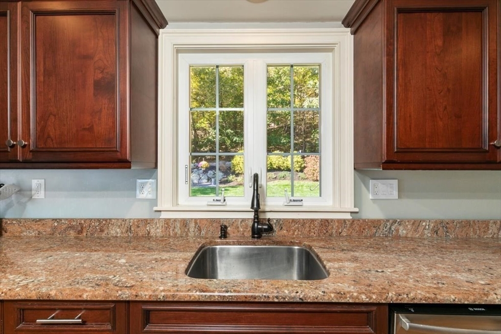 31 Robert Street Wakefield, MA 01880 - Photo 15 of 41 a kitchen with granite countertop a sink and a window