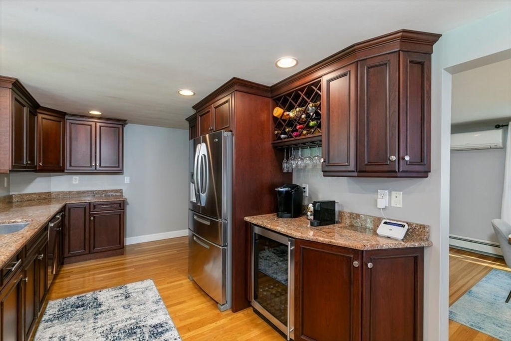 31 Robert Street Wakefield, MA 01880 - Photo 16 of 41 a kitchen with stainless steel appliances granite countertop a sink stove and refrigerator